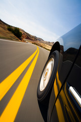 car driving through mountains with motion blur