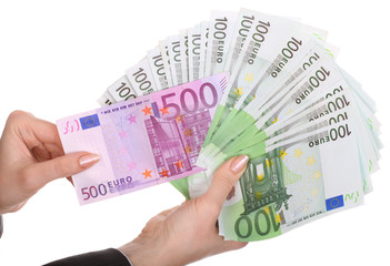 Money in female hands. Isolated.