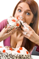 Young hungry gluttonous woman eating pie, isolated