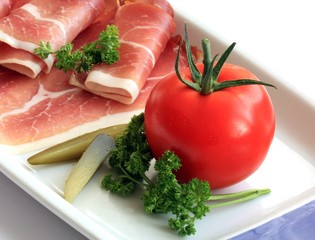 Ham and vegetable on plate