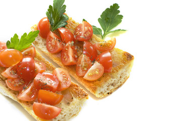 Two bruschetta with tomatoes on white