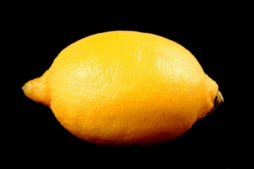 Fresh, healthy lemon isolated on black background.