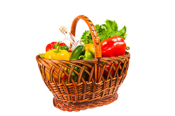 wicker basket with vegetables isolated on white background