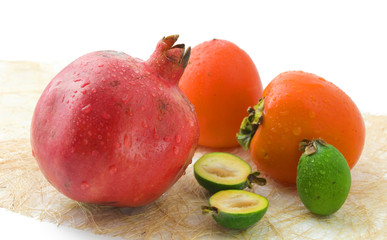 Wet fruits on white