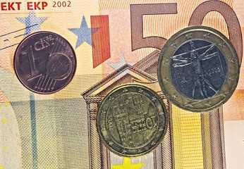 Euro coins with euro banknote