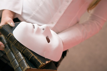 law books with a mask