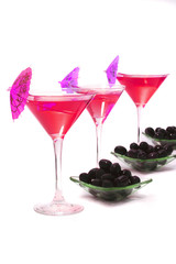 wine glasses with coctail and olives