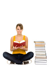 Fototapeta premium Female student sitting with books