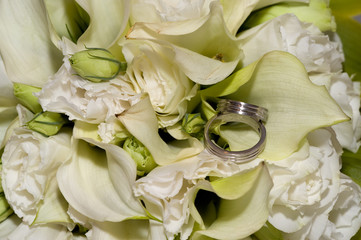 Wedding rings in flowers