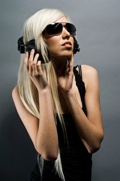 Beautiful young Blonde woman with headphones