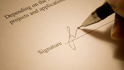 Signature. Close-up of a pen.