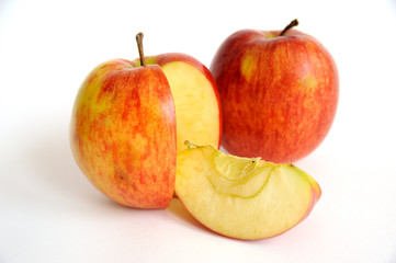Naklejka na ściany i meble Two red apples with a slice