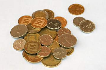 Pile of Israel coins isolated on white background