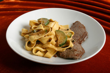 Paste with veal and a vegetable marrow.