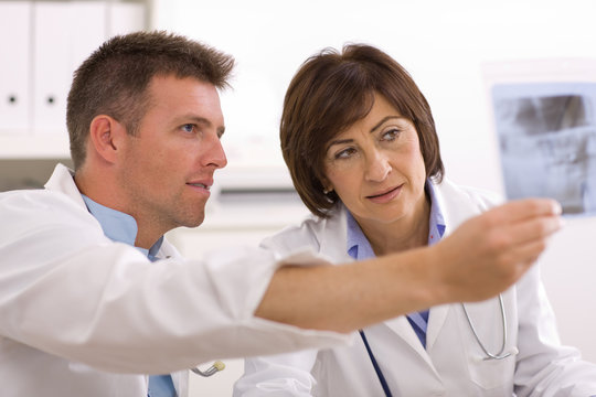 Doctors looking at x-ray image