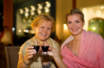 Two beautiful women celebrating
