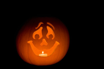 Carved pumpkin Jack-O-Lantern with happy face