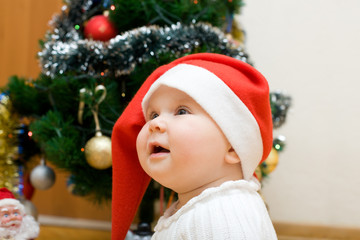 Wishing girl in red Santa hat