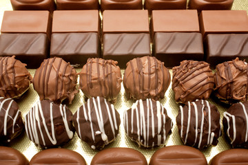 close up shot of chocolates on white background