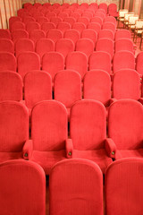 red chairs in the empty small cinema auditorium