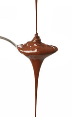 Melted chocolate flowing on a spoon