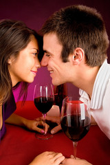 Couple Getting Closer While Having Wine