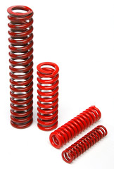 Various metal springs over white