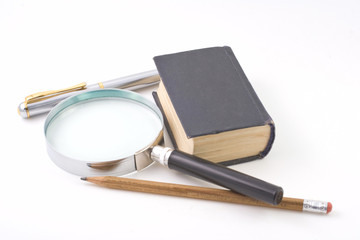 Old book and magnifying glass