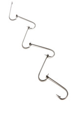 Fishing hooks nicely arranged against white