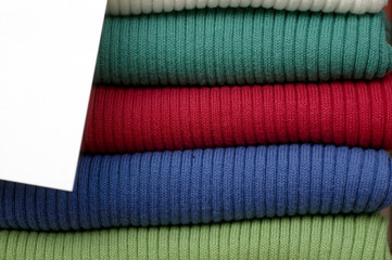 Retail fashion clothing store stack of womens sweaters