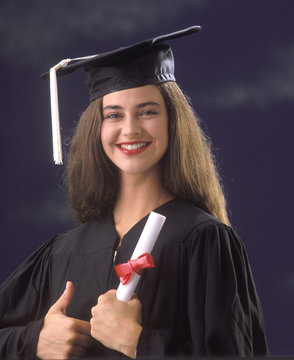 female university graduate holding her diploma