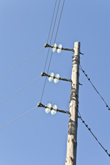 Electrical post with power cables and insulators