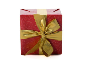 Red gift with gold ribbon on white background