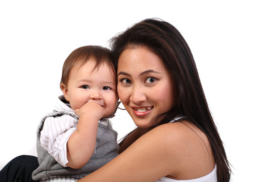 happy mother with baby over white