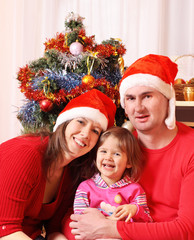 Obraz na płótnie Canvas family with christmas fir