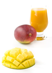 Fresh mango and glass of mango juice