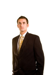 Young Man in Business Suit Hands in Pockets Looking Up