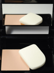 Powder background with mirror