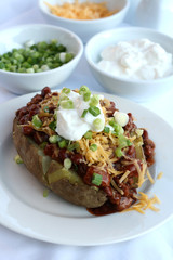Baked Potato with Chili Cheese and Sour Cream