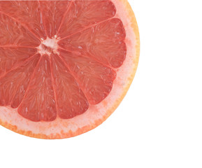 Close up of grapefruit section isolated on white background