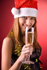 Smiling Mrs. Santa with champagne