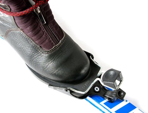 Ski boot and fastening on ski.
