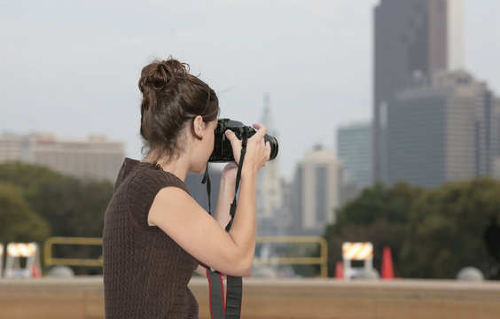 woman taking photos