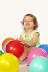 Fototapeta na wymiar Little girl and balloons.
