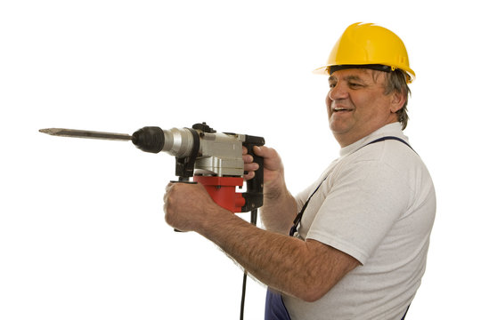 Arbeiter mit Bohrhammer und Schutzhelm