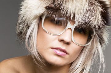 pretty blond model in fur hat and sunglasses