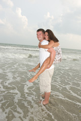 Fototapeta na wymiar Couple in Love at the Beach