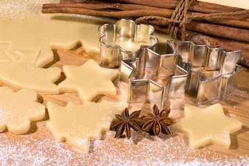 Dough and christmas cookie cutter forms