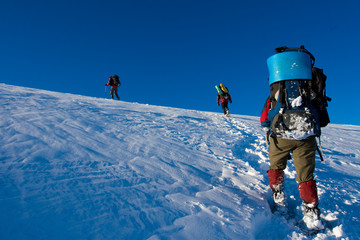 Hiker are in winter in mountains