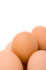 A pile of eggs isolated on a white background